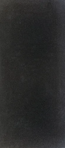 A deep black, finely textured matte surface.