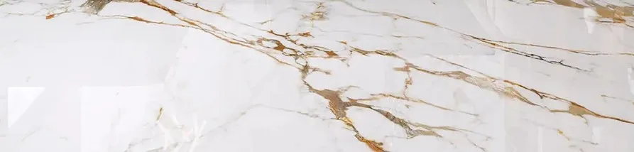 Polished white marble surface with prominent, flowing golden and brown veins.